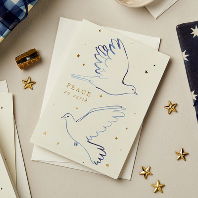 Cream holiday card with two blue doves and gold foil greeting