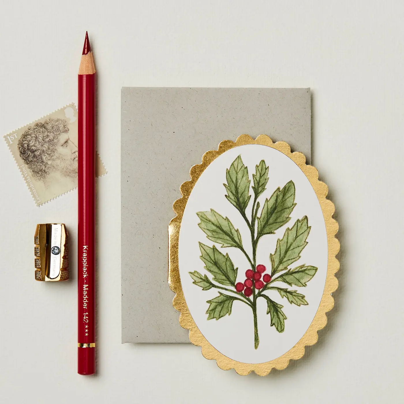 Mini card with festive holly illustration and gold foil details